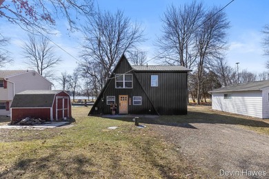Tucked along 64 feet of private channel frontage with direct - photo 2