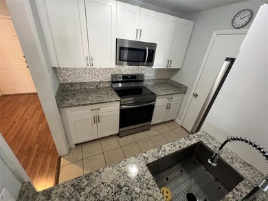 ALL AGES GATED COMMUNITY FIRST FLOOR UNIT TOTALLY REMODELED WITH - photo 17