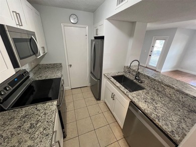 ALL AGES GATED COMMUNITY FIRST FLOOR UNIT TOTALLY REMODELED WITH - photo 18