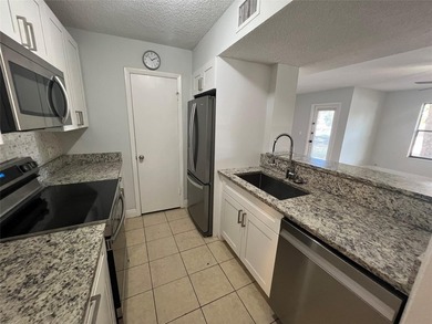 ALL AGES GATED COMMUNITY FIRST FLOOR UNIT TOTALLY REMODELED WITH - photo 19