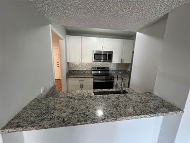 ALL AGES GATED COMMUNITY FIRST FLOOR UNIT TOTALLY REMODELED WITH - photo 20