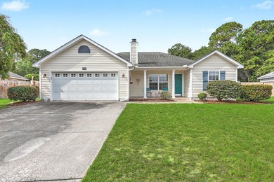 Nestled on a prime corner lot with serene pond views, this - photo 1