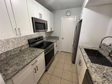 ALL AGES GATED COMMUNITY FIRST FLOOR UNIT TOTALLY REMODELED WITH - photo 21