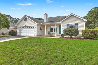 Nestled on a prime corner lot with serene pond views, this - photo 2