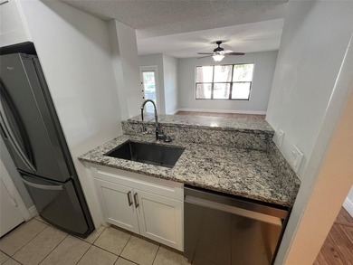ALL AGES GATED COMMUNITY FIRST FLOOR UNIT TOTALLY REMODELED WITH - photo 22
