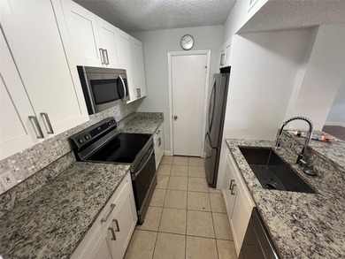 ALL AGES GATED COMMUNITY FIRST FLOOR UNIT TOTALLY REMODELED WITH - photo 23