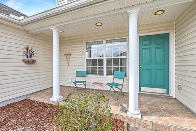 Nestled on a prime corner lot with serene pond views, this - photo 5