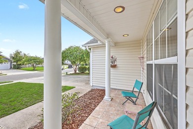 Nestled on a prime corner lot with serene pond views, this - photo 6