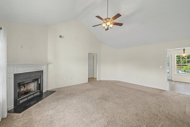 Nestled on a prime corner lot with serene pond views, this - photo 7