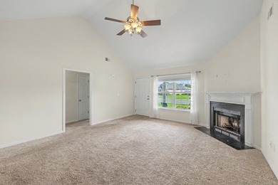 Nestled on a prime corner lot with serene pond views, this - photo 9