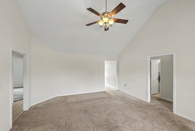 Nestled on a prime corner lot with serene pond views, this - photo 10