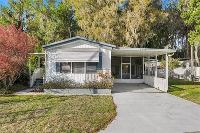 Tucked into a quiet waterfront community, this well-kept home - photo 1