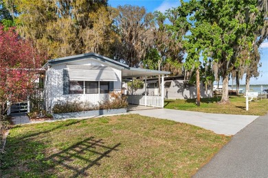 Tucked into a quiet waterfront community, this well-kept home - photo 2