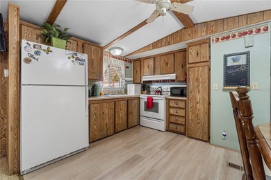 Tucked into a quiet waterfront community, this well-kept home - photo 9