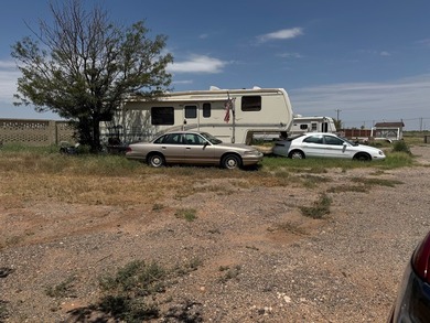 2.5 Acres Super Location off Loop 250 N. Improvements an updated