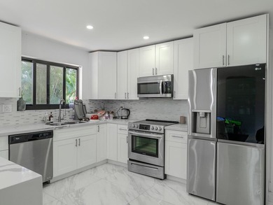 Welcome to this spacious 3-bedroom, 2-bathroom home situated on - photo 8