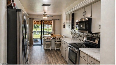 Enjoy true Florida waterfront living in this desirable - photo 3