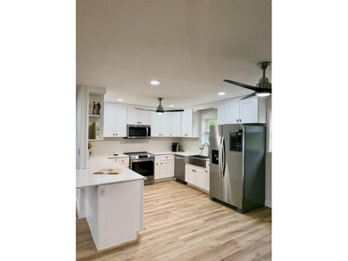 This updated 4-bed, 2-bath home in the highly desired Lake - photo 11