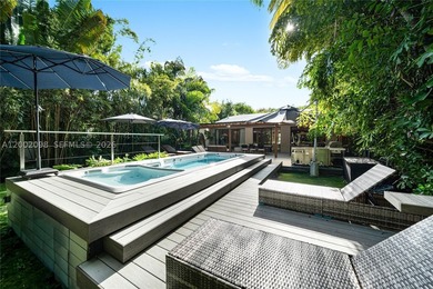 Welcome to this stunning Miami Beach residence where privacy - photo 31