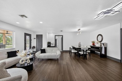 Situated on a rare, oversized lot with serene pond views, this - photo 13
