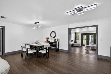 Situated on a rare, oversized lot with serene pond views, this - photo 15
