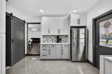 Situated on a rare, oversized lot with serene pond views, this - photo 18