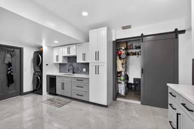 Situated on a rare, oversized lot with serene pond views, this - photo 19