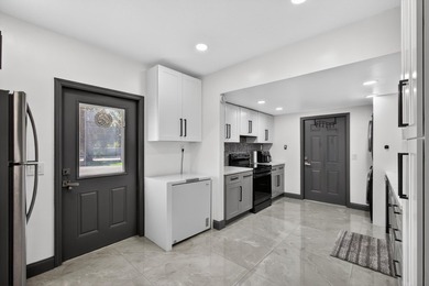 Situated on a rare, oversized lot with serene pond views, this - photo 21