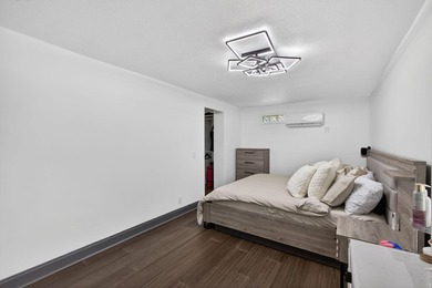 Situated on a rare, oversized lot with serene pond views, this - photo 29