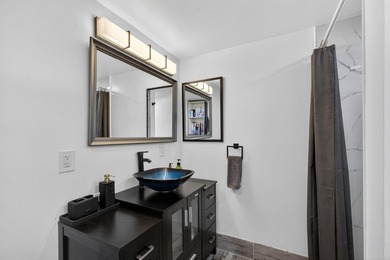 Situated on a rare, oversized lot with serene pond views, this - photo 32