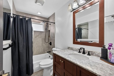 Situated on a rare, oversized lot with serene pond views, this - photo 35