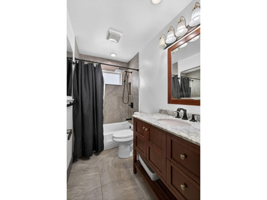 Situated on a rare, oversized lot with serene pond views, this - photo 36