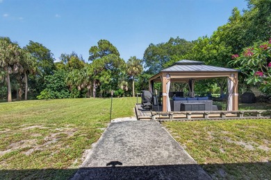 Situated on a rare, oversized lot with serene pond views, this - photo 40