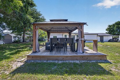 Situated on a rare, oversized lot with serene pond views, this - photo 44