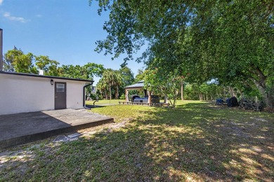 Situated on a rare, oversized lot with serene pond views, this - photo 47