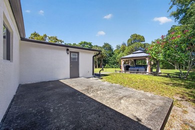 Situated on a rare, oversized lot with serene pond views, this - photo 48