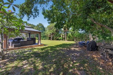 Situated on a rare, oversized lot with serene pond views, this - photo 50