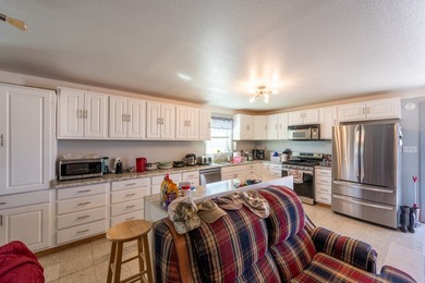 ENJOY THE QUIET OF THE COUNTRY ON THIS BEAUTIFUL 10-ACRE TRACT