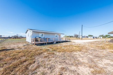 ENJOY THE QUIET OF THE COUNTRY ON THIS BEAUTIFUL 10-ACRE TRACT