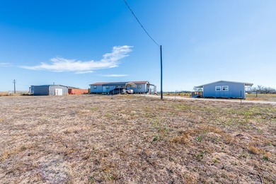 ENJOY THE QUIET OF THE COUNTRY ON THIS BEAUTIFUL 10-ACRE TRACT