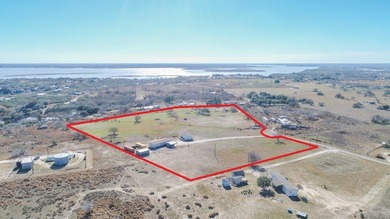 ENJOY THE QUIET OF THE COUNTRY ON THIS BEAUTIFUL 10-ACRE TRACT