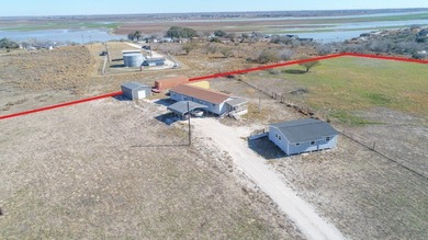 ENJOY THE QUIET OF THE COUNTRY ON THIS BEAUTIFUL 10-ACRE TRACT