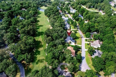 Situated on over a third of an acre on the 18th hole in the - photo 2