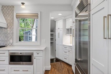 Beautifully updated, embracing its historic character while - photo 14