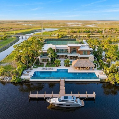 Set along 5+ pristine acres on the storied St. Lucie River, this - photo 4