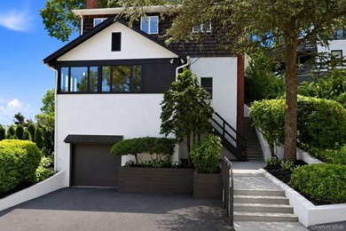 Nestled into the hillside with water views that hold through - photo 2
