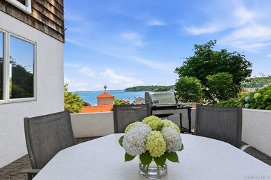 Nestled into the hillside with water views that hold through - photo 4