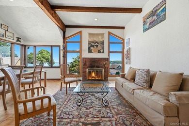 Nestled into the hillside with water views that hold through - photo 5