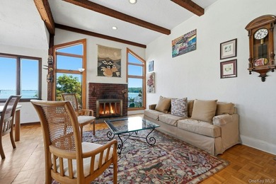 Nestled into the hillside with water views that hold through - photo 6