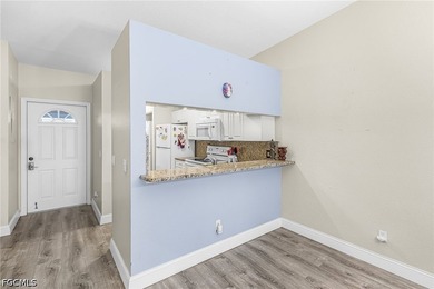 Welcome to this beautifully located first-floor condo in the - photo 2